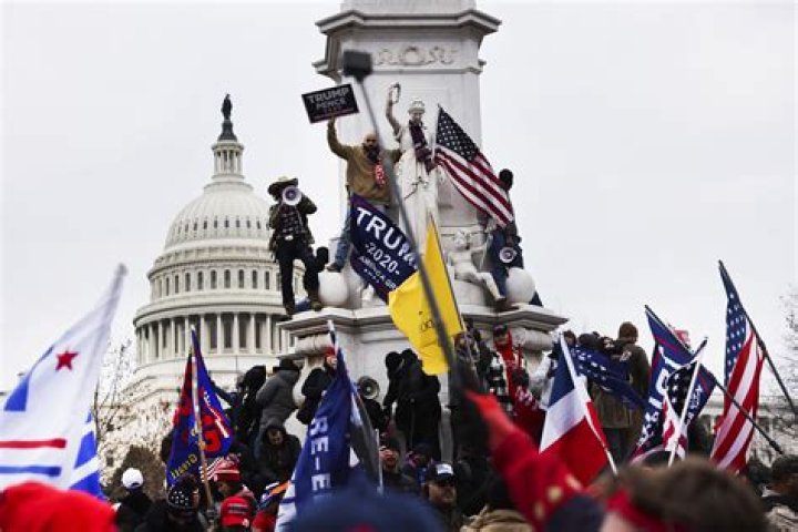 Trump supporters gather outside the Capitol, Wednesday, Jan. 6, 2021, in Washington. As Congress prepares to affirm President-elect Joe Biden's victory, thousands of people have gathered to show their support for President Donald Trump and his claims of election fraud. (AP Photo/Manuel Balce Ceneta)